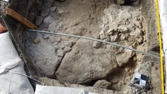 Foundation revealed inside excavation unit