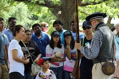 Visitors at the Alamo find out about 1830s firearms from a living historian.