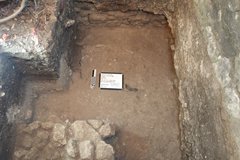 Smooth dirt surface inside an excavation unit